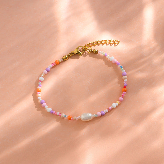 Perlenarmband 'flieder-rosa' im Säckchen mit Herz